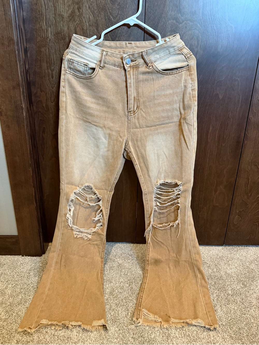 Womenโs Distressed Flared Jeans in Light Brown